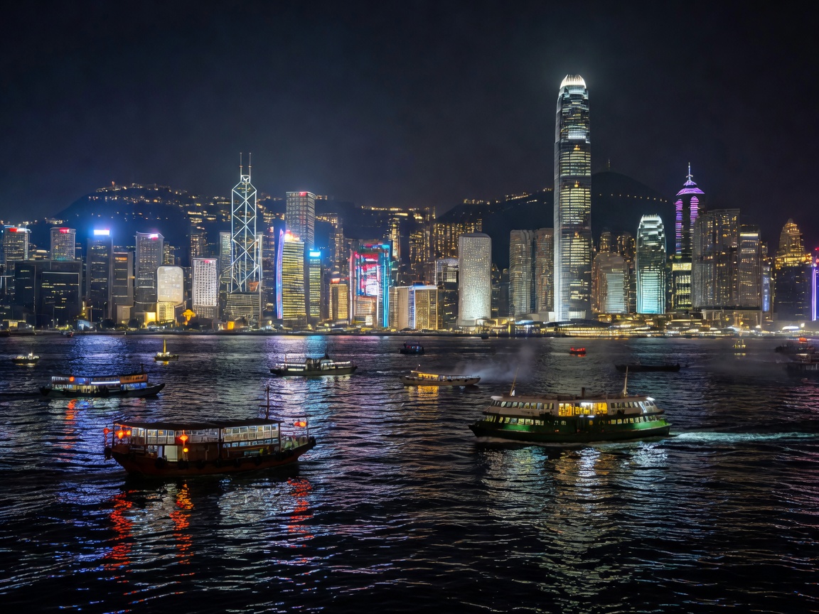 Hong Kong Victoria Harbour with lights and boats